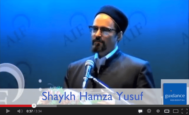 Shaykh Hamza Yusuf speaking at podium