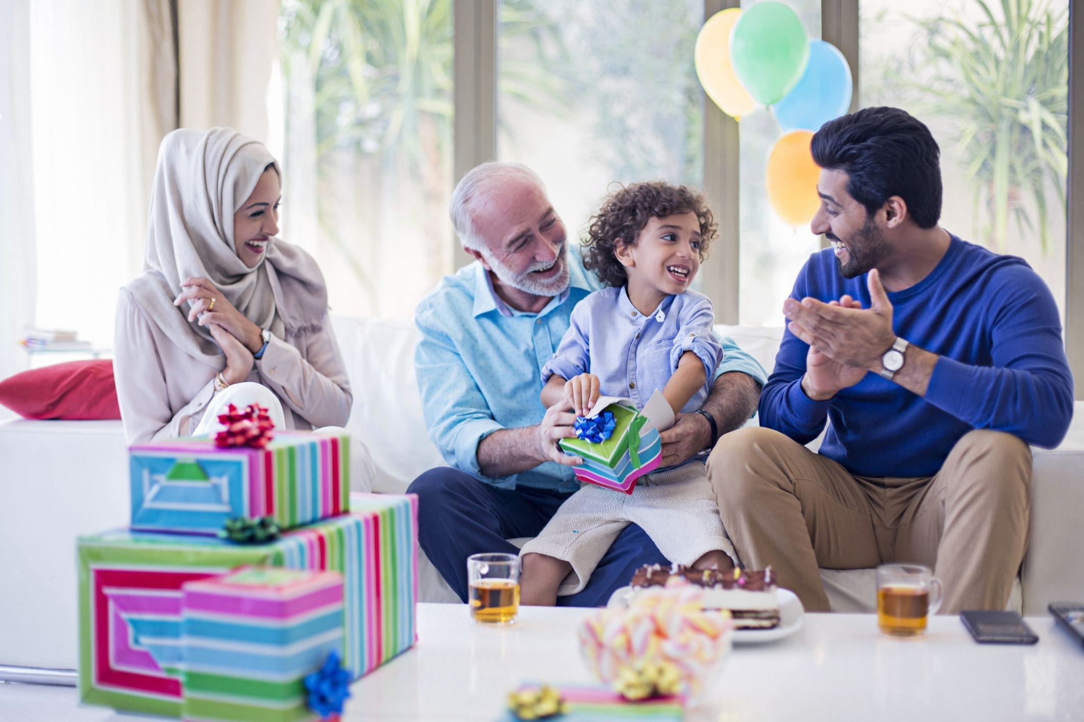 family members playing with child