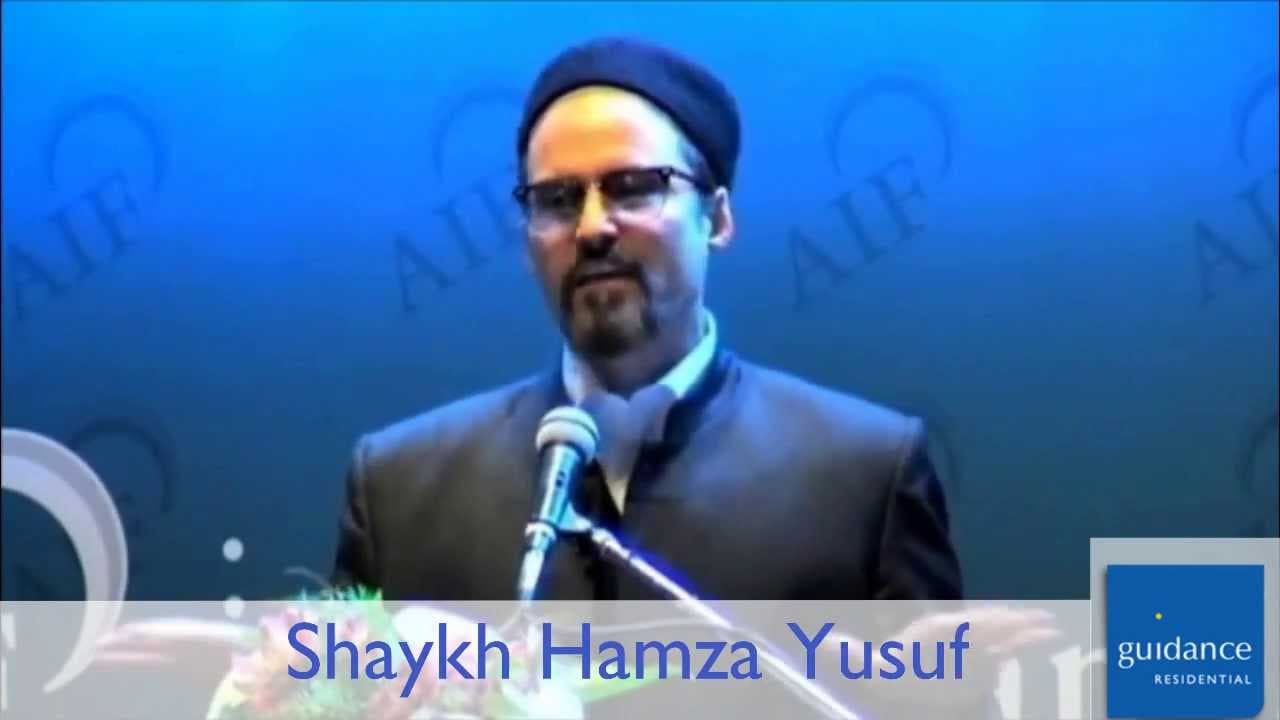 Shaykh Hamza Yusuf at a podium